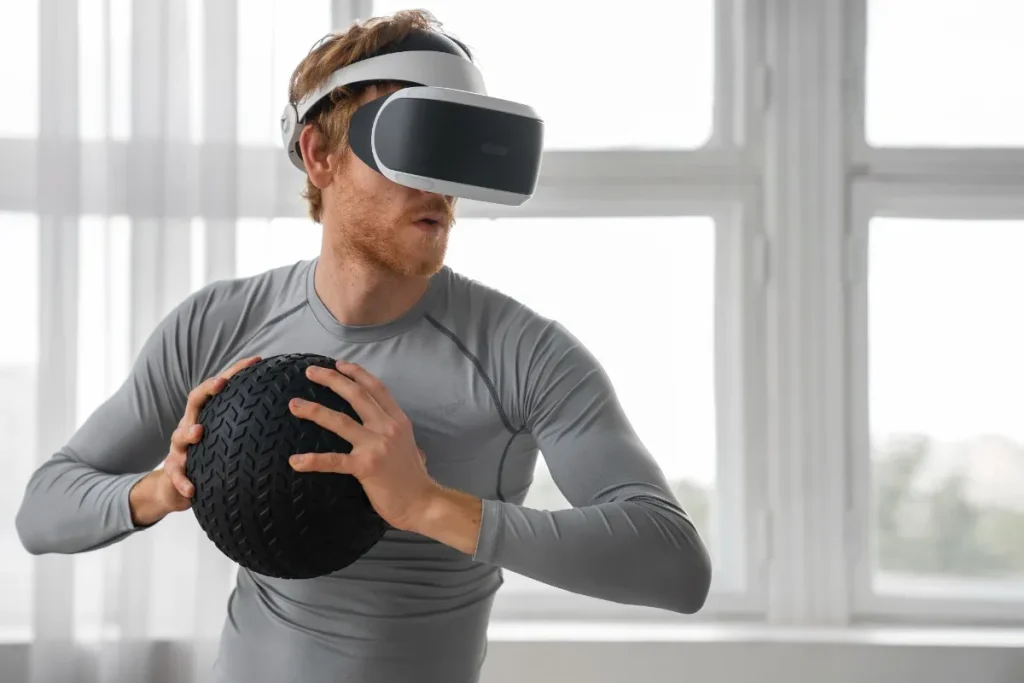 Man wearing VR headset holding textured fitness ball during Tech Etruesports virtual reality workout session in bright home gym