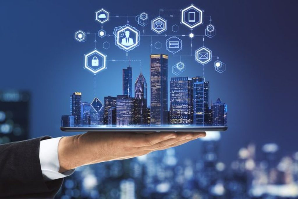 Business professional holding tablet displaying illuminated smart city skyline with connected IoT icons showing how technology drive innovation and progress in urban development