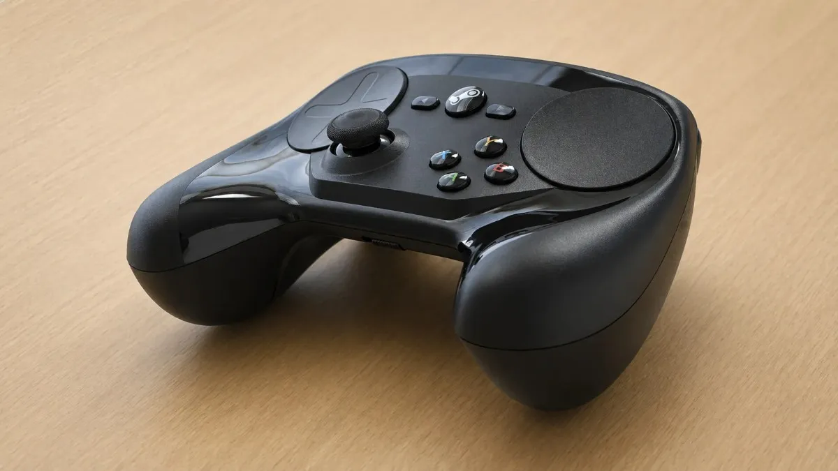 High-quality 16:9 close-up of a black Steam Controller with touchpads and control buttons placed on a light wooden surface.