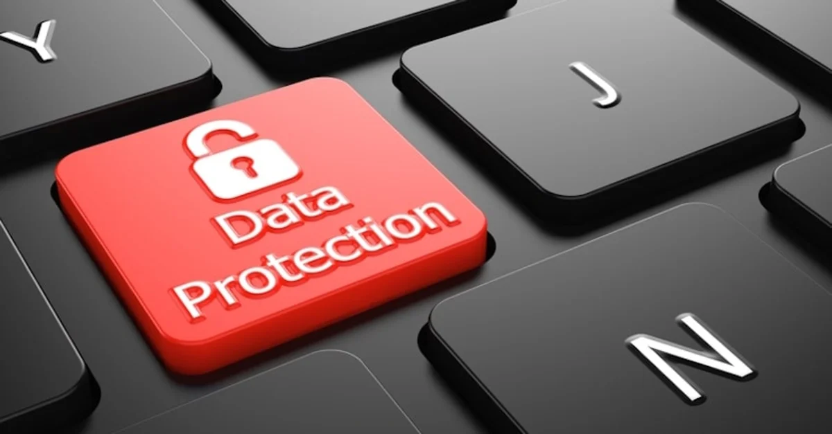 A close-up digital rendering of a microchip processor featuring a glowing blue security shield and keyhole icon, serving as a pillar graphic for a cybersecurity checklist for gaming companies.