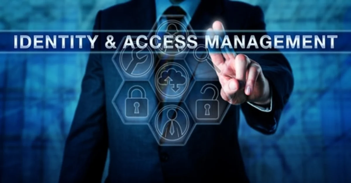 A corporate professional interacting with a digital interface displaying Identity and Access Management (IAM) icons, illustrating an essential control for a cybersecurity checklist for gaming companies.